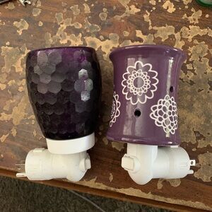 Two beautiful purple Scentsy plug in warmers